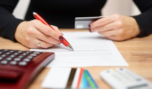 56812638 - woman is opening bank account and checking  credit card informations