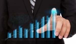 businessman-touching-the-tip-of-a-bar-chart_1232-898