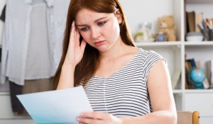 Girl is working with project and upset for problems with it