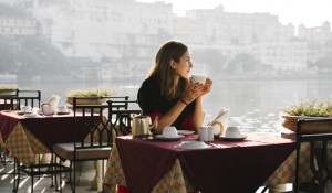 Western woman having a teatime at a cafe in Udaipur