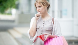 pensive-girl-holding-her-purse_1163-66
