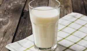 glass-milk-white-napkin-wooden-table_23-2147872558