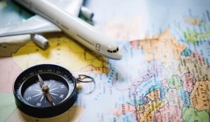 selective-focus-miniature-tourist-compass-map-with-plastic-toy-airplane-abstract-background-travel-concept_1423-180