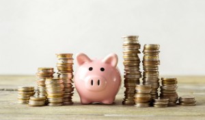 piggy-bank-with-coin-old-wooden-table_93675-22194