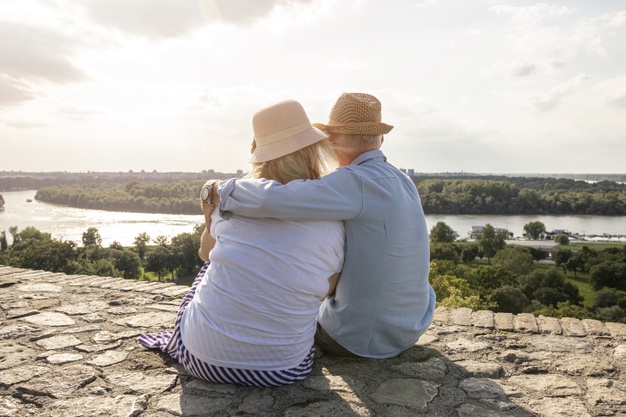 old-lovers-sitting-backview-shot_23-2148293948